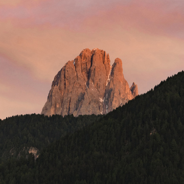 Rocky mountain peak with trees in the foreground