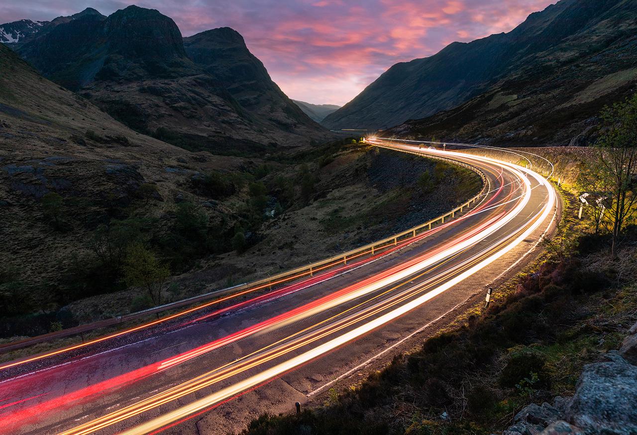 Long exposed car lights travelling on a road