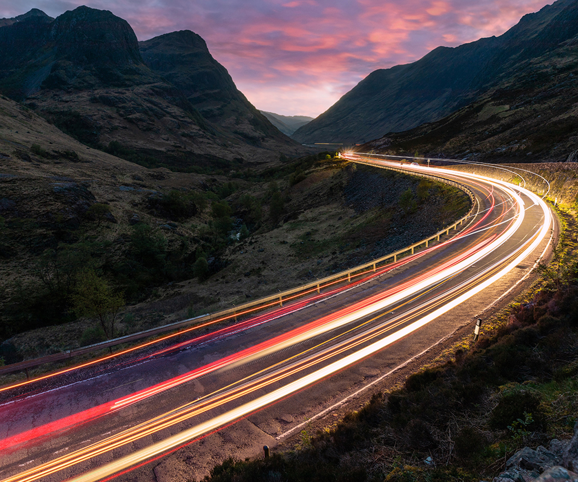 Long exposed car lights travelling on a road