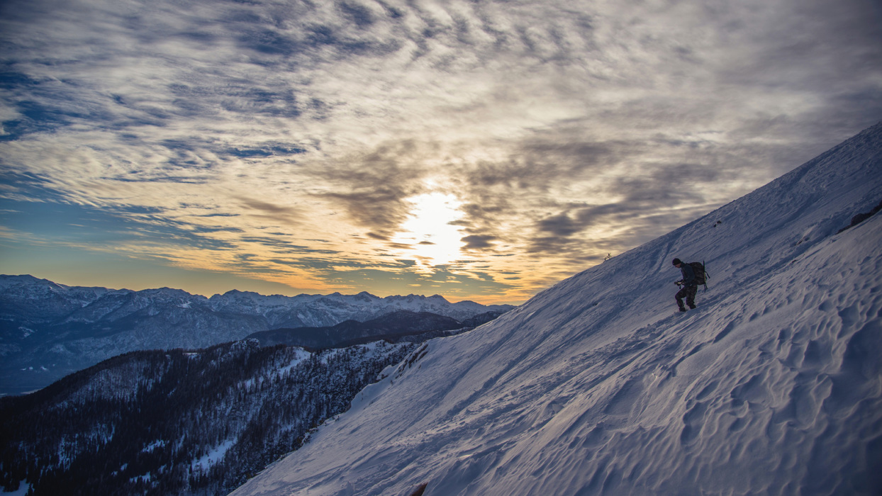 Person descending snowy mountain