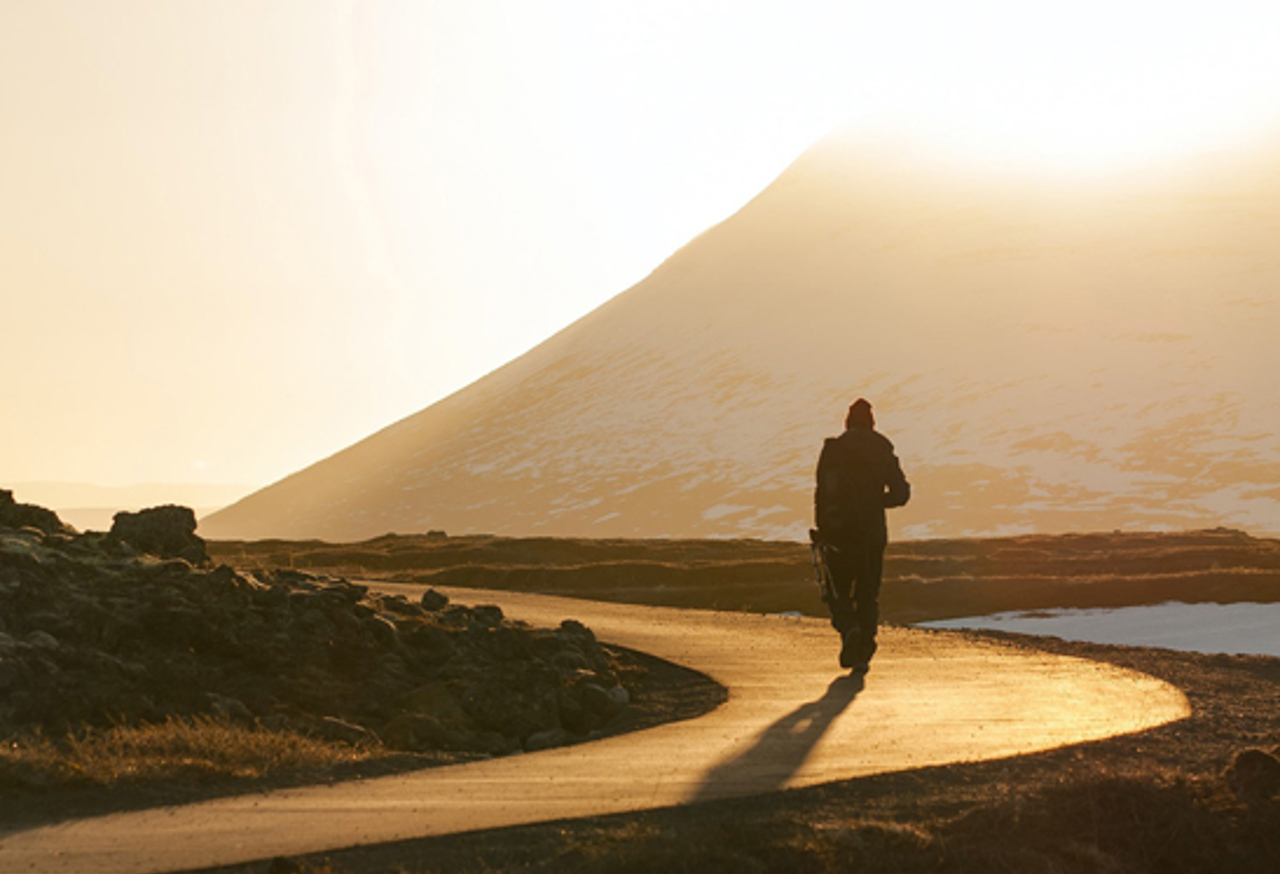 Man walking along road