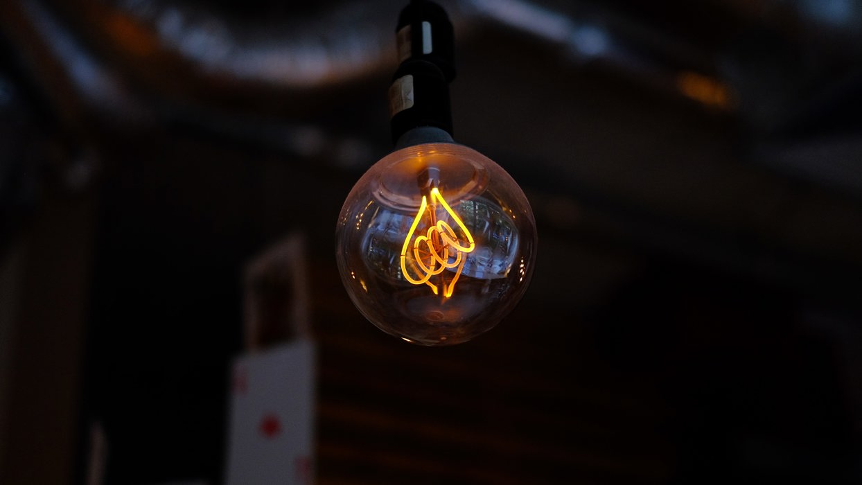Lightbulb Against A Dark Background