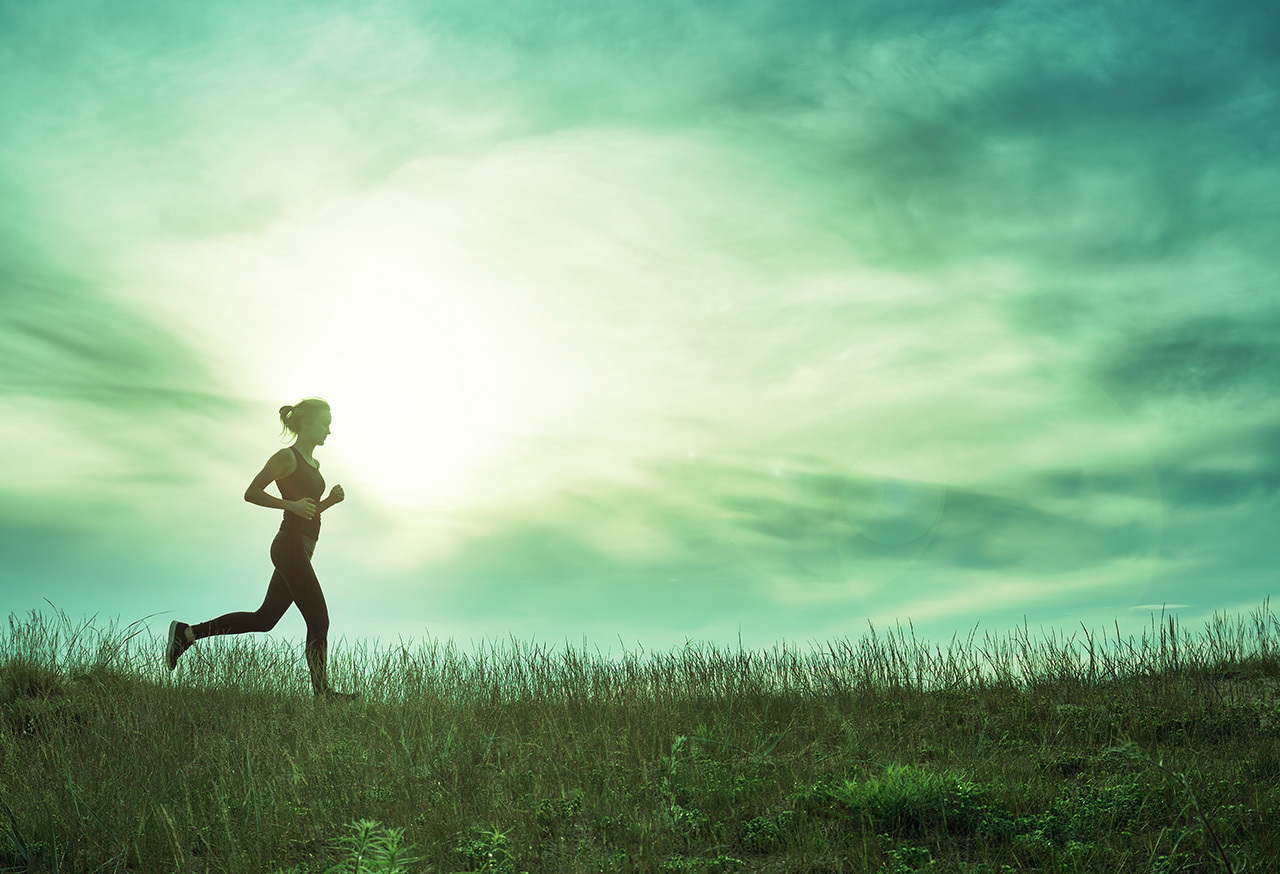 Woman running in a field