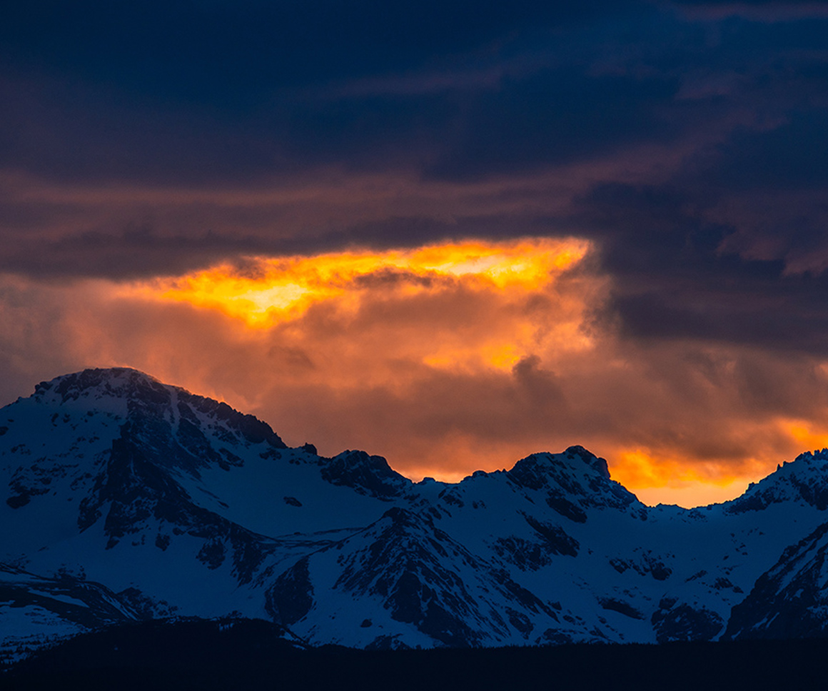 Sunset Over Snowy Mountain Range