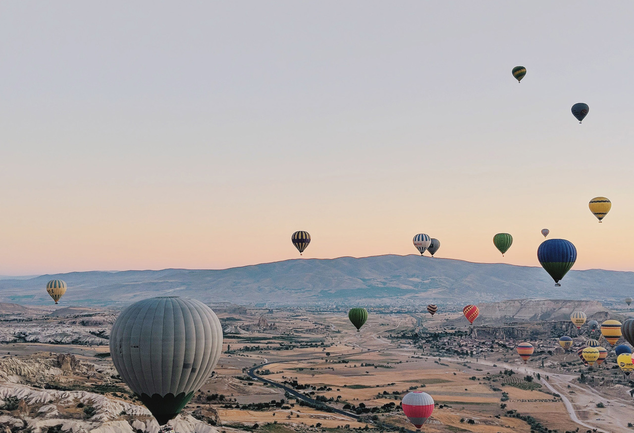 Hot air balloons over a desert