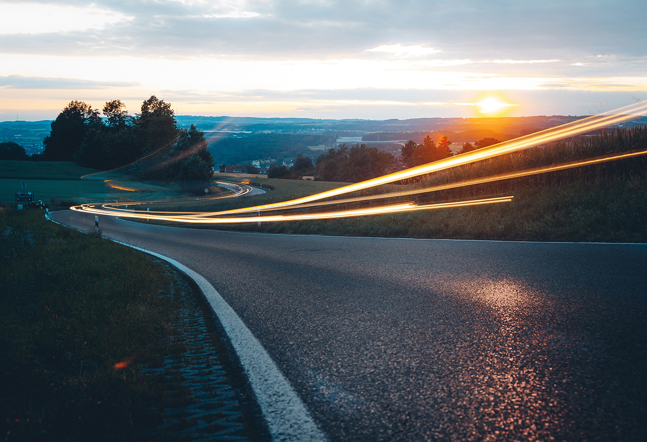 Abstract lights on a road at sunset