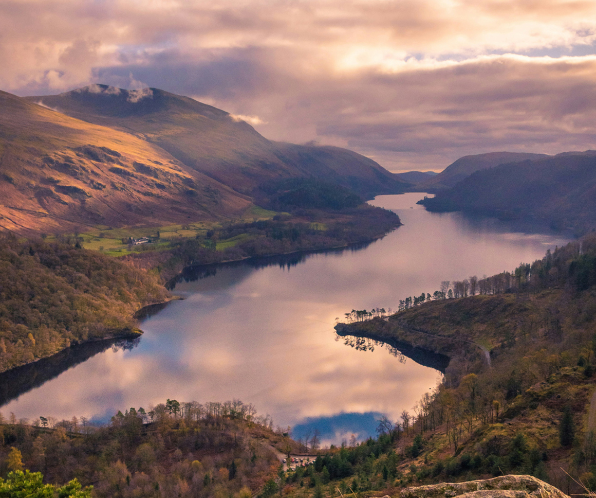 View of large lake surrounded by hills