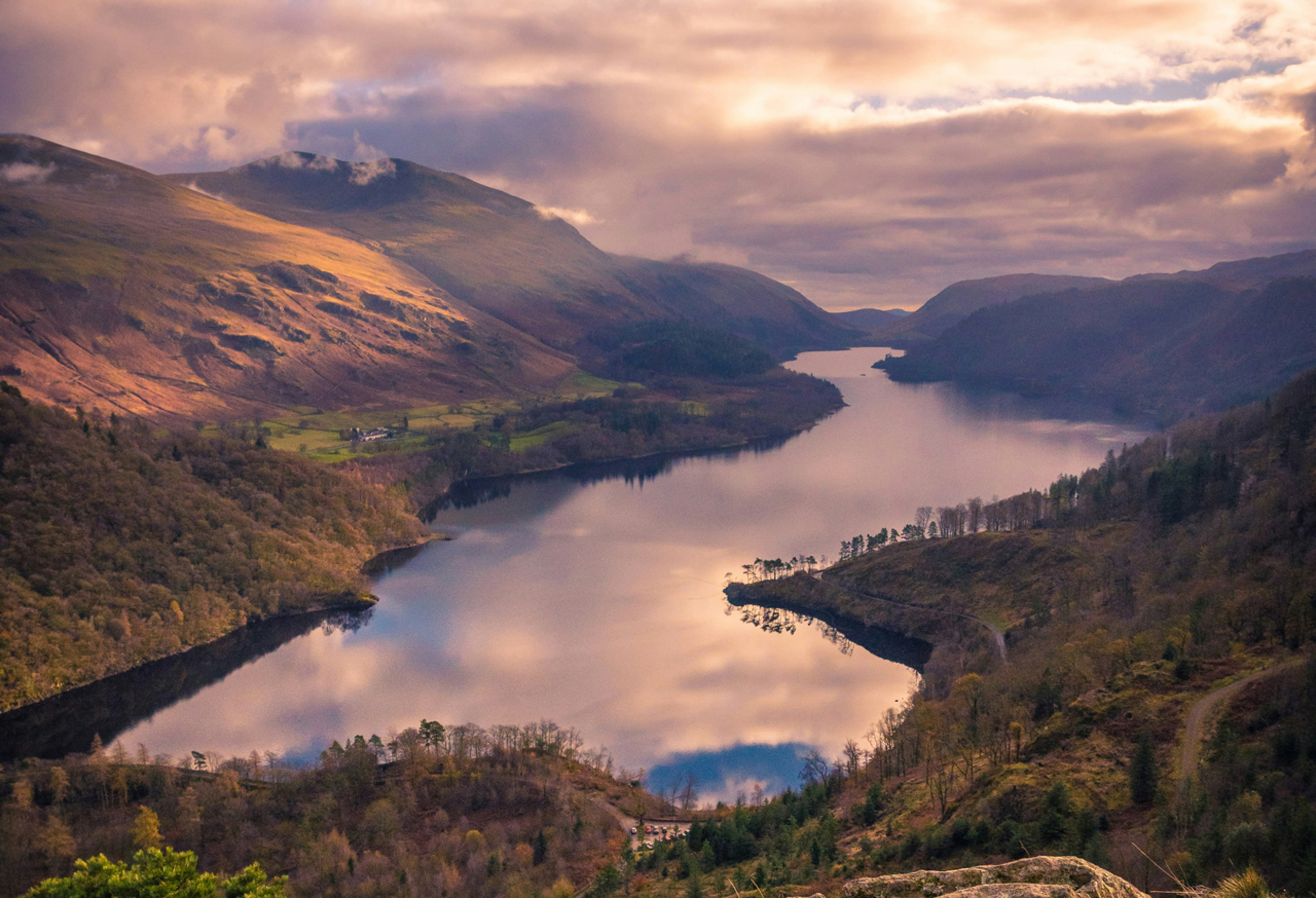 View of large lake surrounded by hills