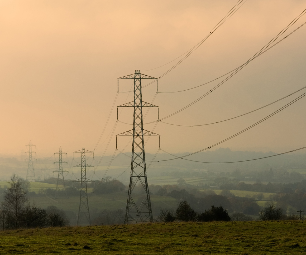 Transmission Wires On A Misty Morning In The Countryside