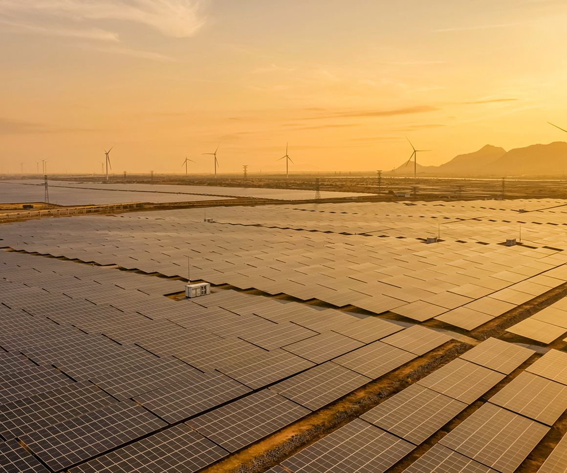 Field of solar panels and wind turbines