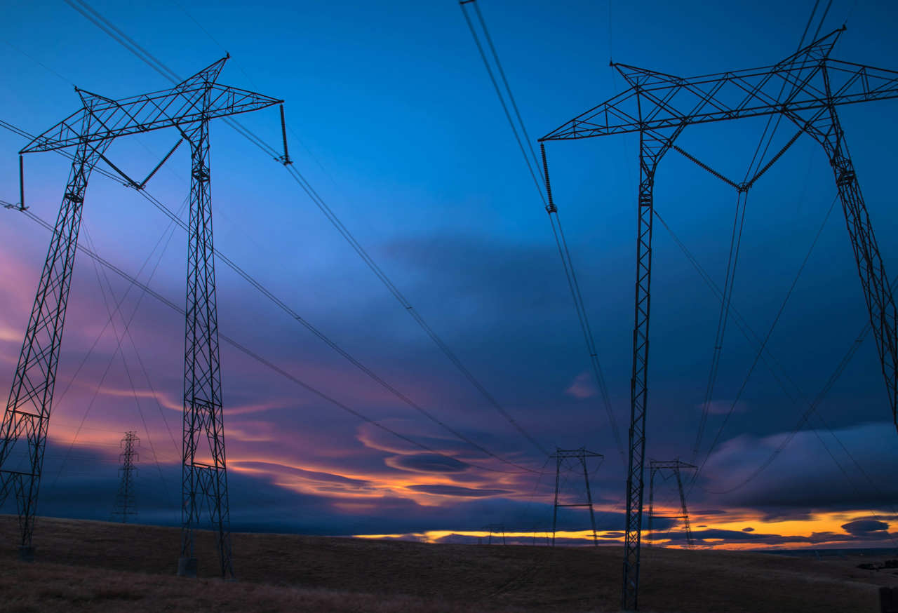 Electricity pylons at night