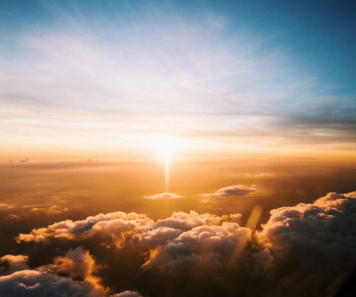 Plane wing above clouds