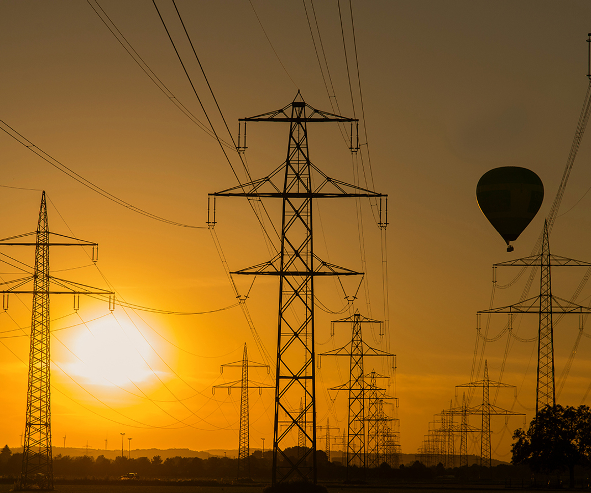 Hot air balloon flying behind pylons