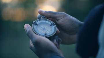 Man Holding Compass