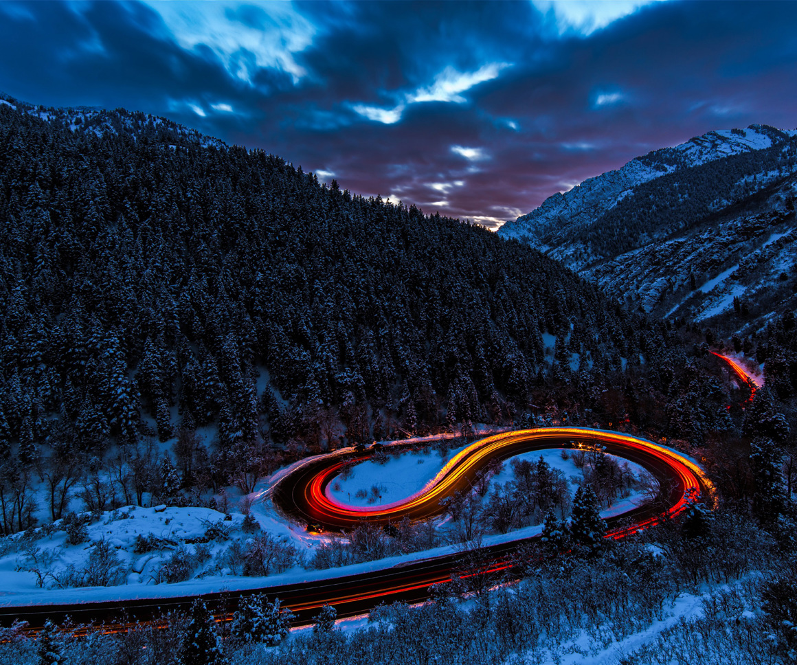 Winding road in snowy countryside