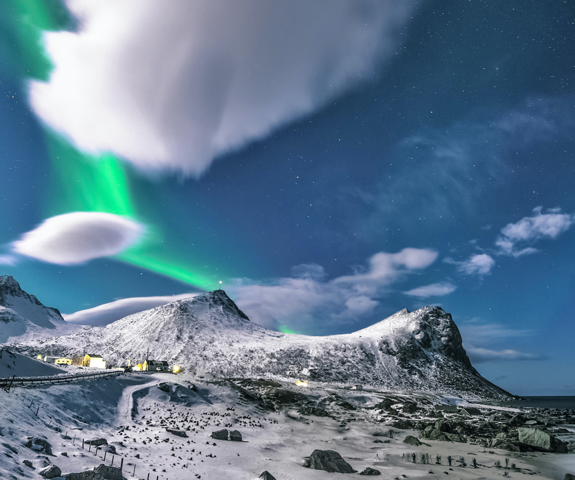 Northern Lights above snowy town